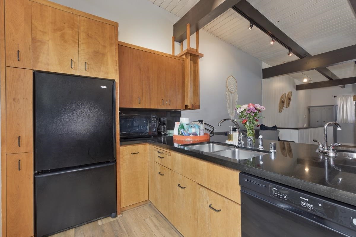 4 Kelley Road, Unit 5 Mammoth Lakes, CA 93546 - Photo 7 of 30 a kitchen with stainless steel appliances granite countertop a refrigerator sink and cabinets
