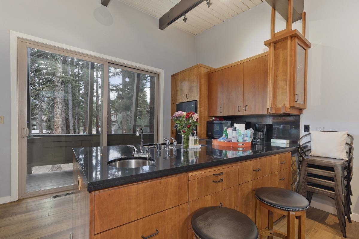 4 Kelley Road, Unit 5 Mammoth Lakes, CA 93546 - Photo 9 of 30 a kitchen with stainless steel appliances granite countertop a sink and a cabinets
