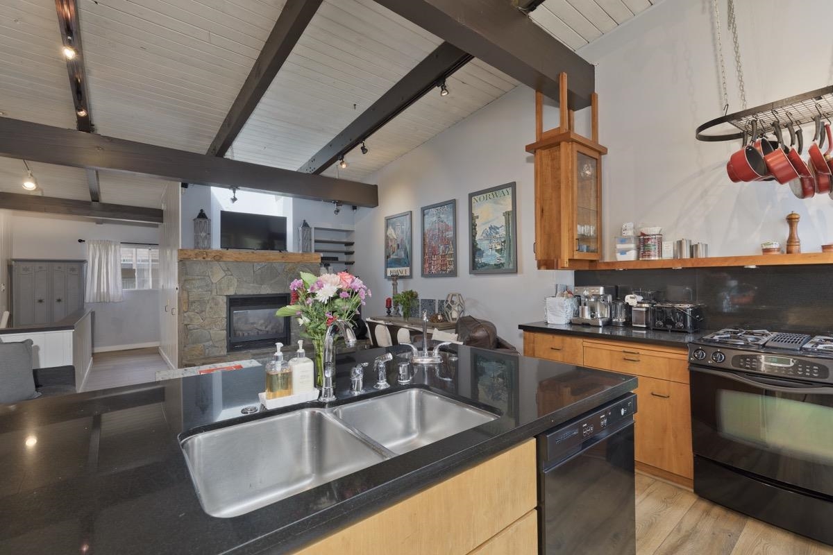 4 Kelley Road, Unit 5 Mammoth Lakes, CA 93546 - Photo 10 of 30 a kitchen with stainless steel appliances granite countertop a sink a stove and a wooden floors