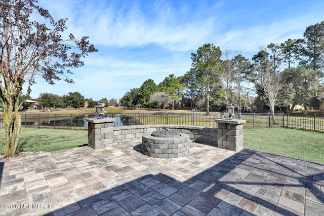 a view of a backyard with sitting area