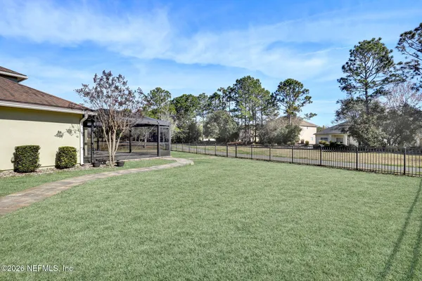 a view of a house with a big yard