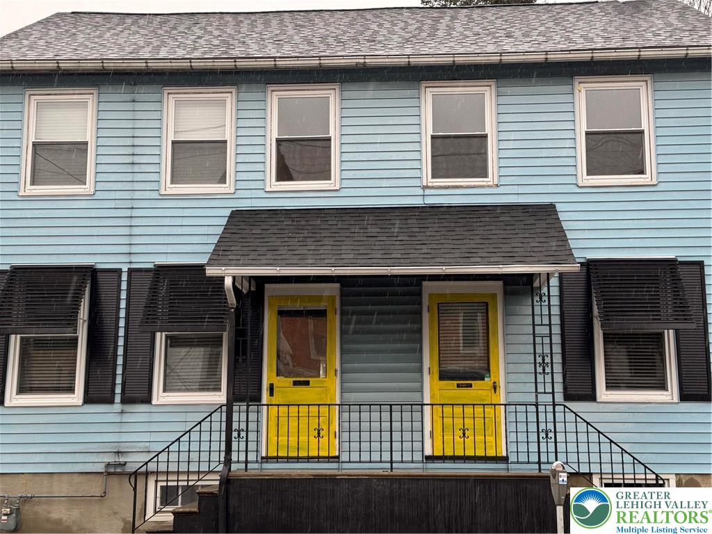 a view of a house with small yard