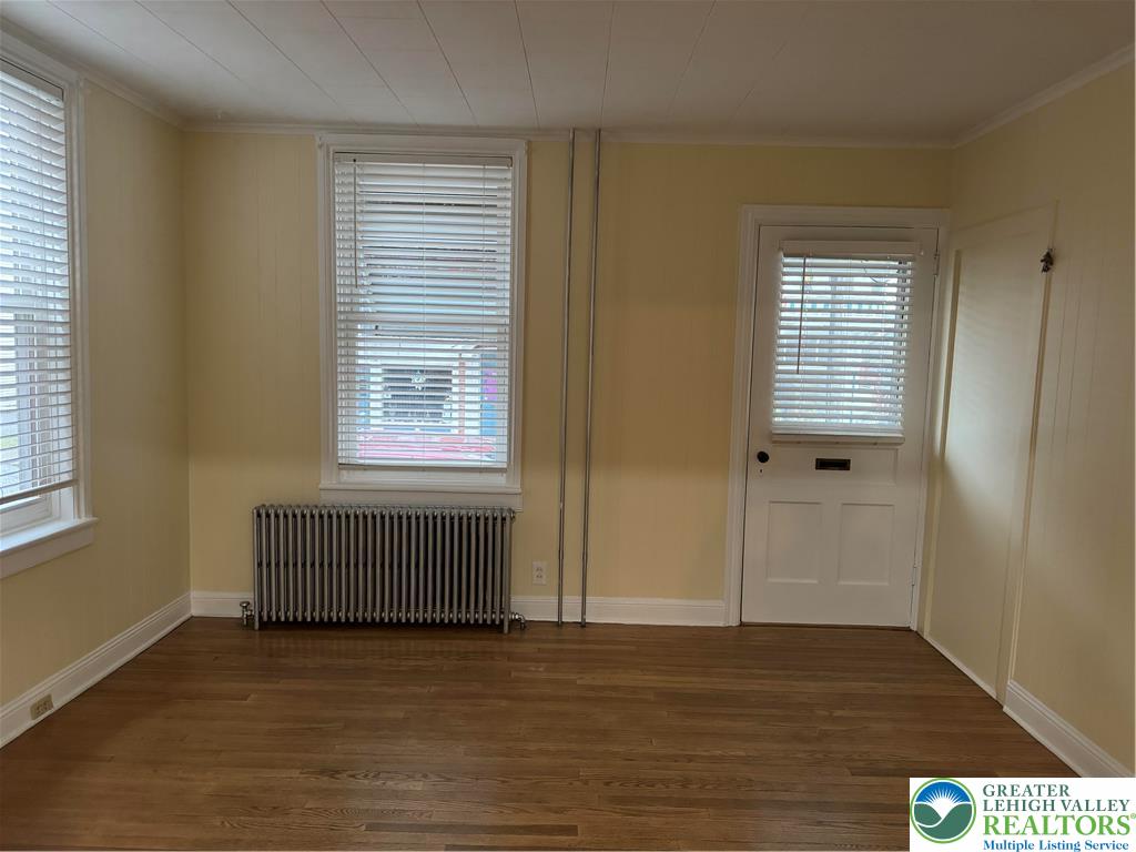 149 South Main Street Nazareth, PA 18064 - Photo 3 of 9 a view of an empty room with wooden floor and a window