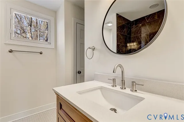 a bathroom with a sink and a mirror