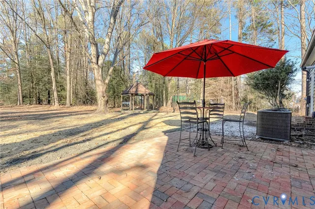 a view of a chairs and tables in the patio
