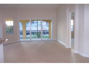 1281 Rialto Way, Unit 201 Naples, FL 34114 - Photo 3 of 6 a view of a room with a large window