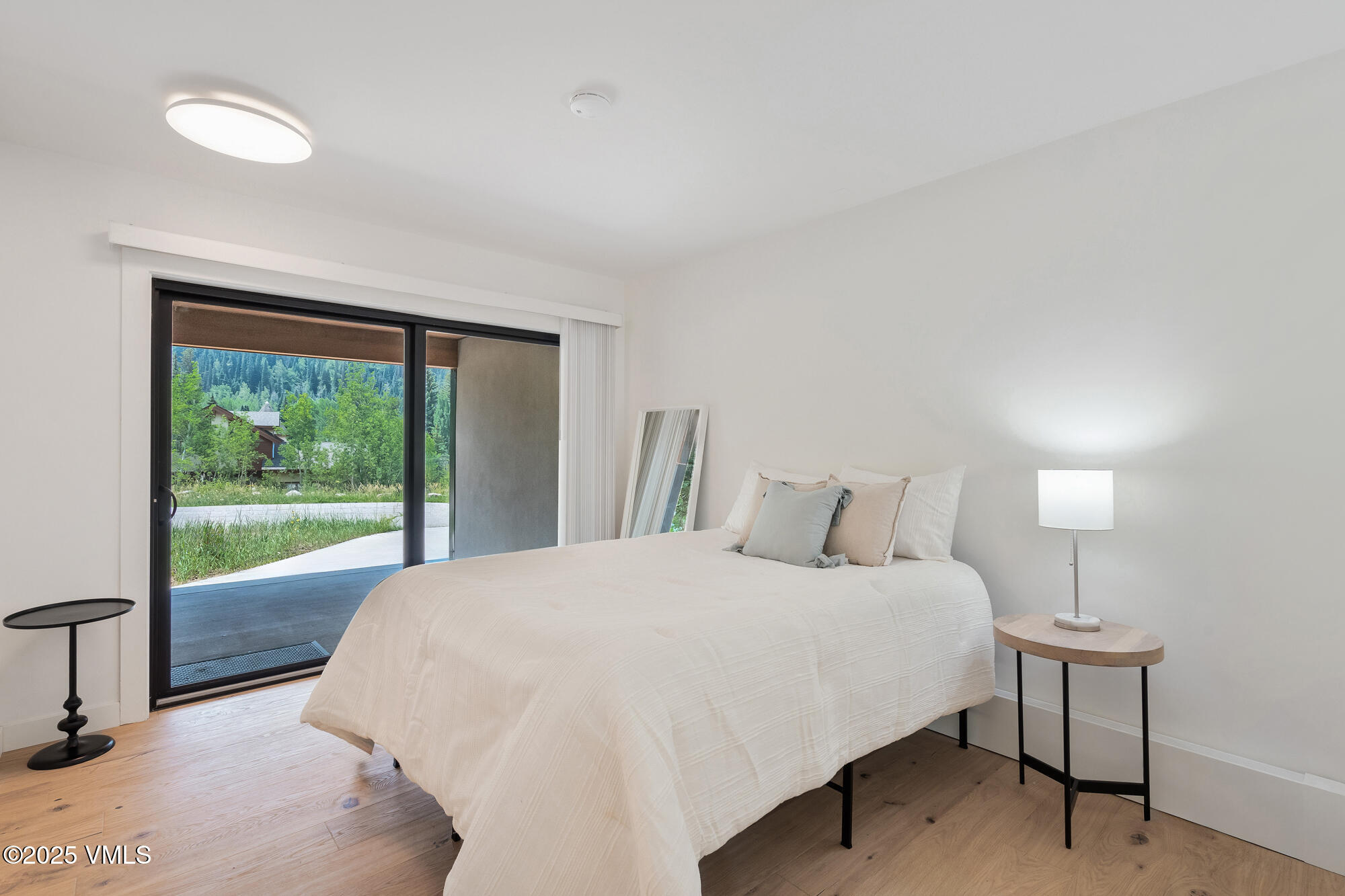 4545 Big Horn Road Vail, CO 81657 - Photo 37 of 49 a bedroom with a bed and a large window