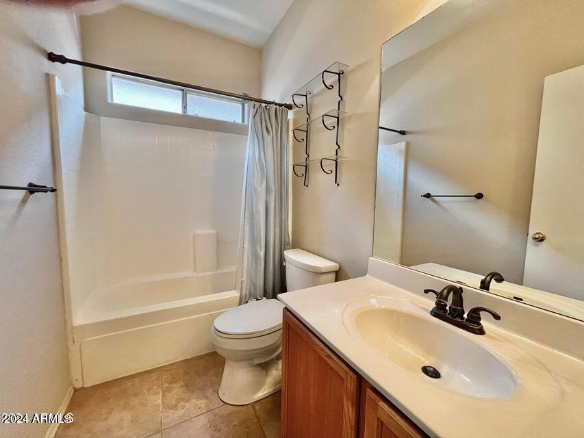 16908 West Northampton Road Surprise, AZ 85374 - Photo 12 of 13 a bathroom with a sink toilet and shower