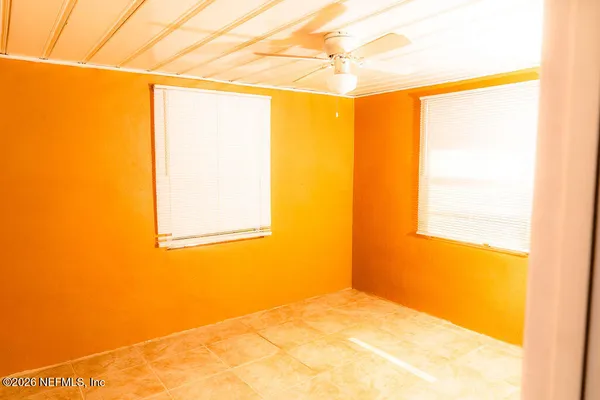 a view of a room next to a window