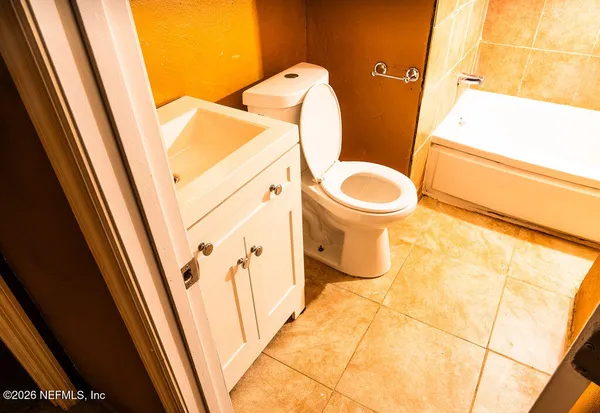 a bathroom with a sink and toilet