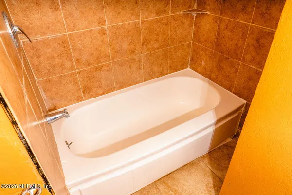 a bathroom with a bathtub