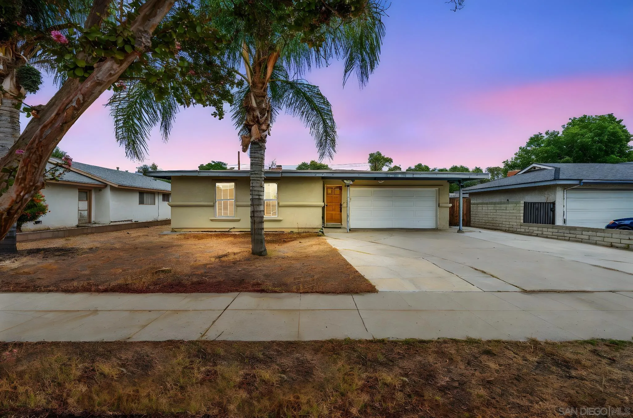 6656 Cathy Place Riverside, CA 92504 - Photo 1 of 49 a front view of a house with a yard and palm trees