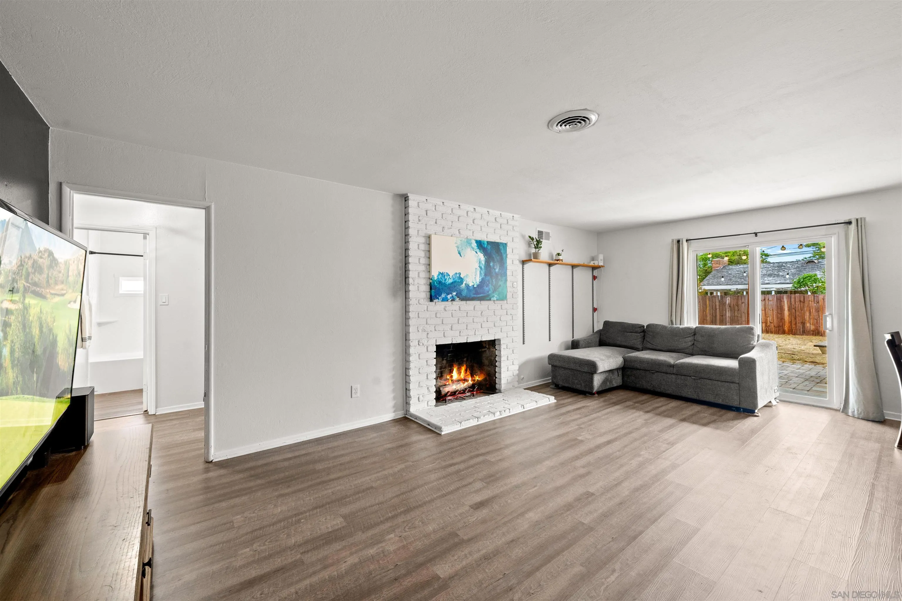 6656 Cathy Place Riverside, CA 92504 - Photo 12 of 49 a living room with furniture and a fireplace
