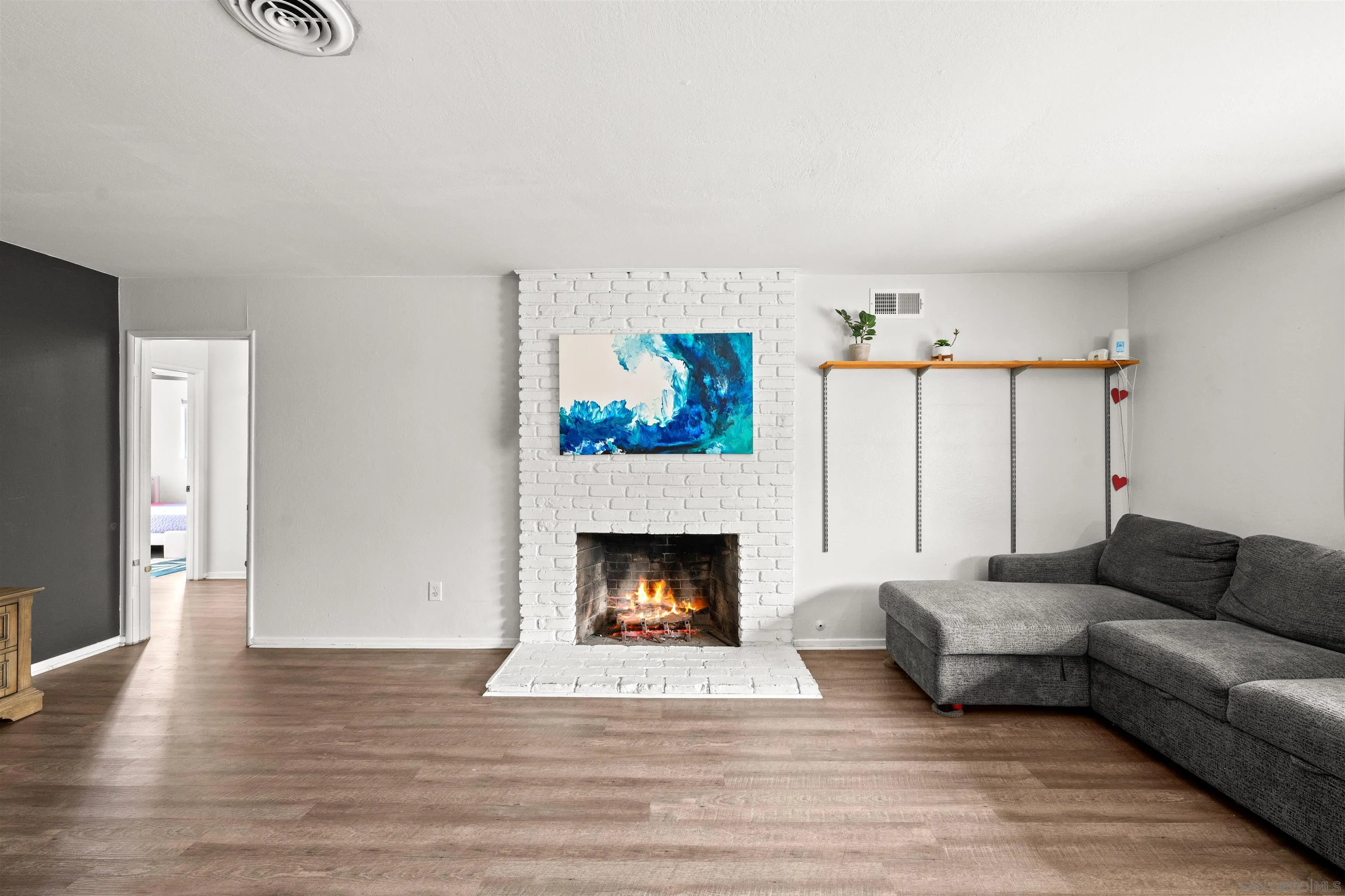 6656 Cathy Place Riverside, CA 92504 - Photo 13 of 49 a living room with furniture and a fireplace
