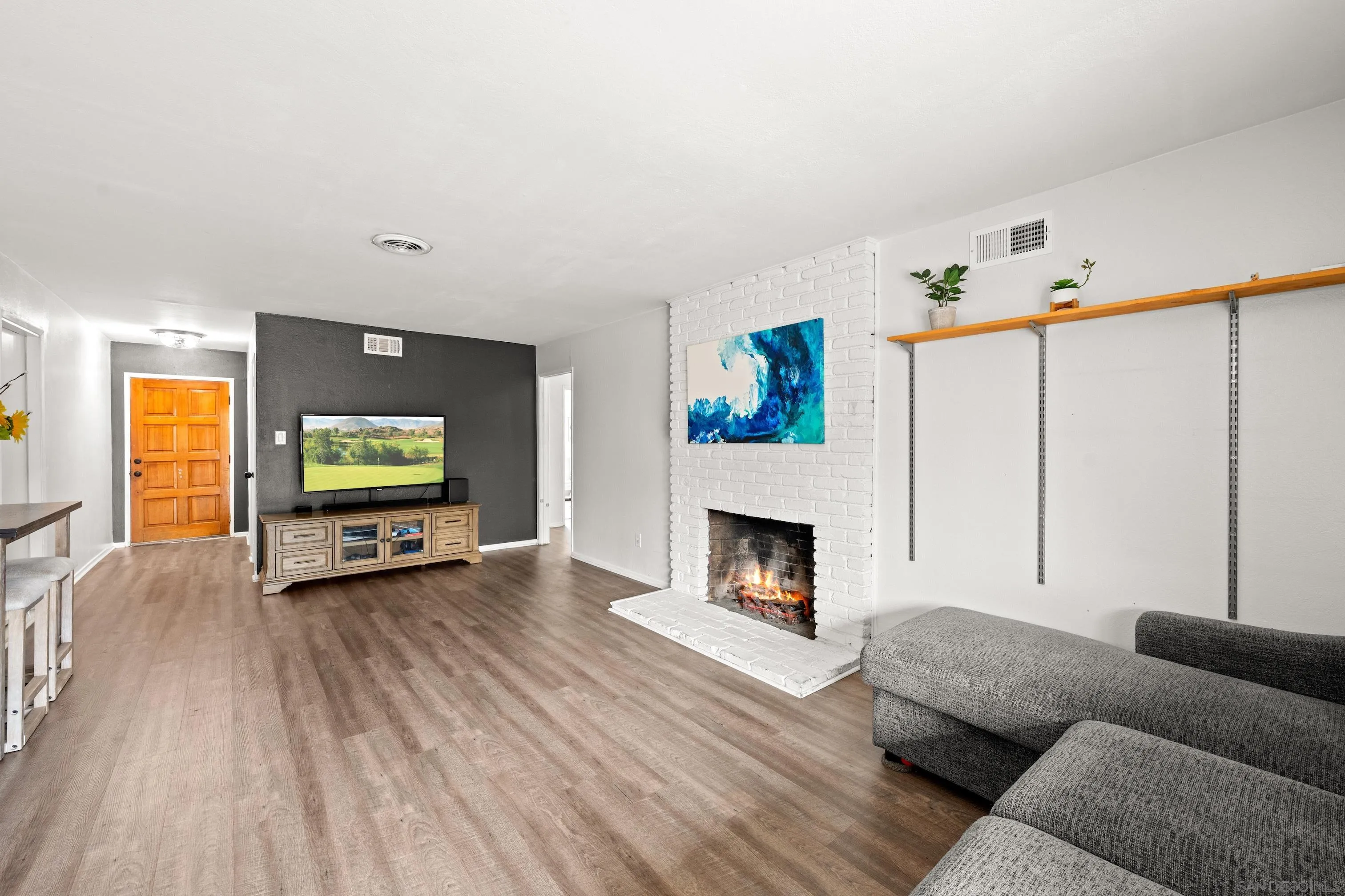 6656 Cathy Place Riverside, CA 92504 - Photo 15 of 49 a living room with furniture and a flat screen tv
