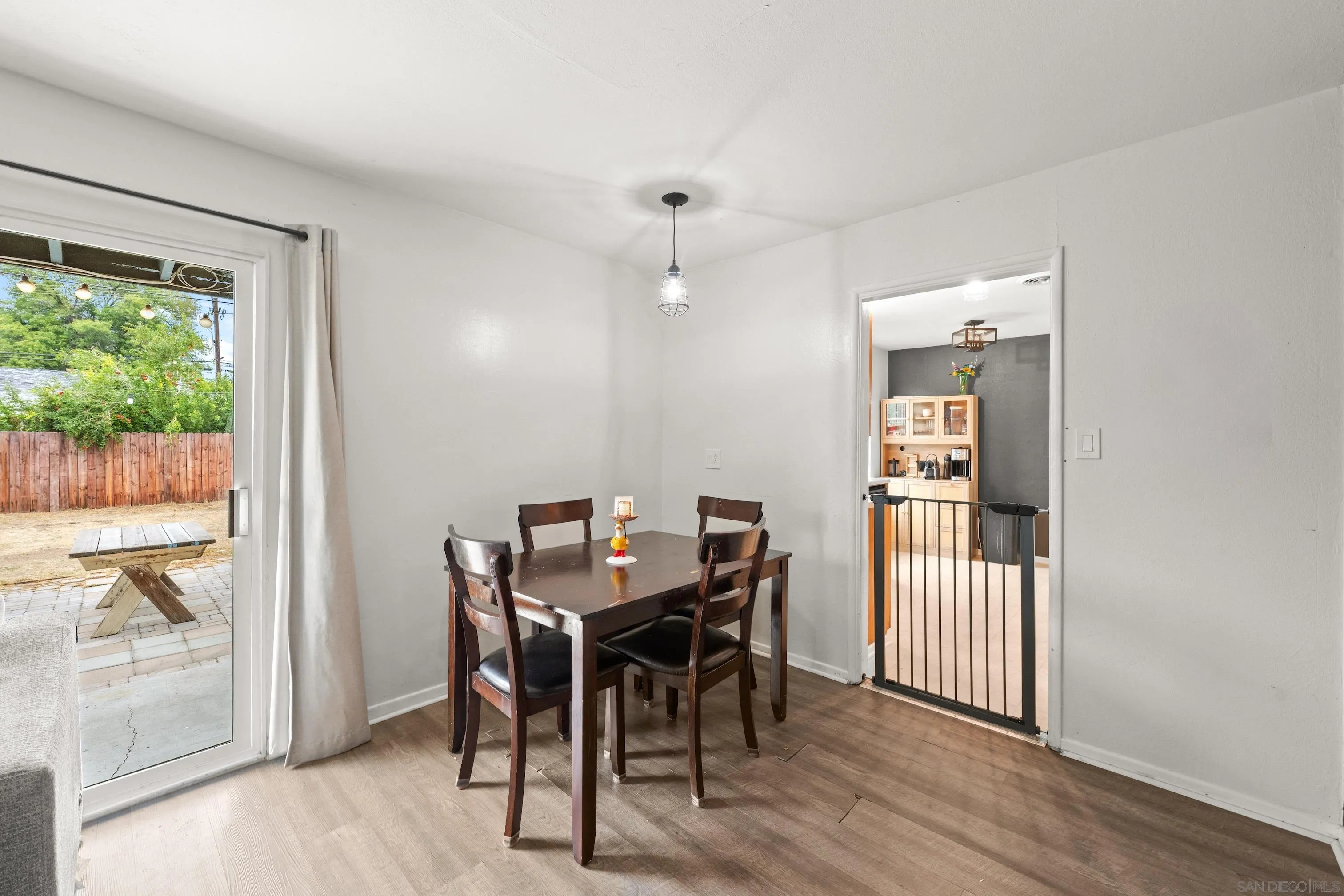 6656 Cathy Place Riverside, CA 92504 - Photo 18 of 49 a view of a dining room with furniture window and wooden floor