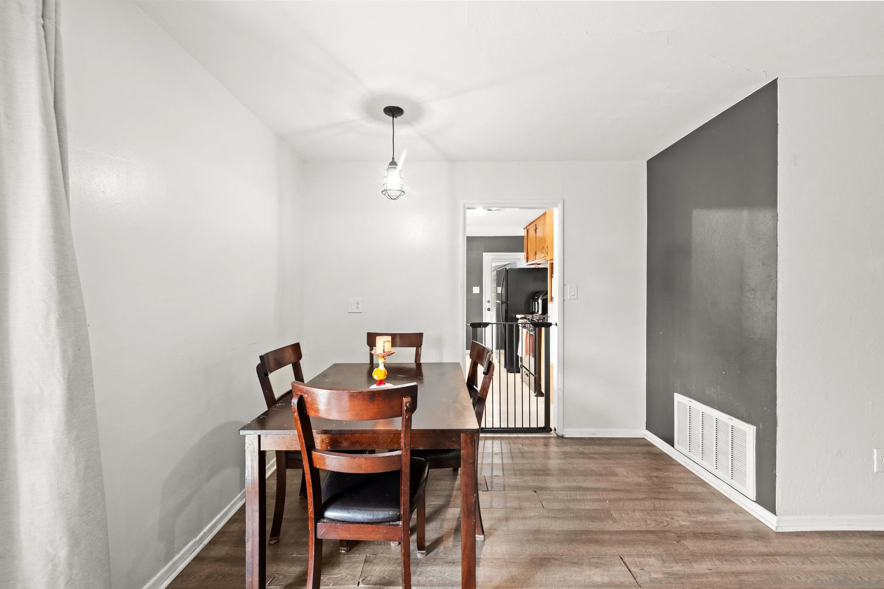 6656 Cathy Place Riverside, CA 92504 - Photo 19 of 49 a view of a dining room with furniture and wooden floor