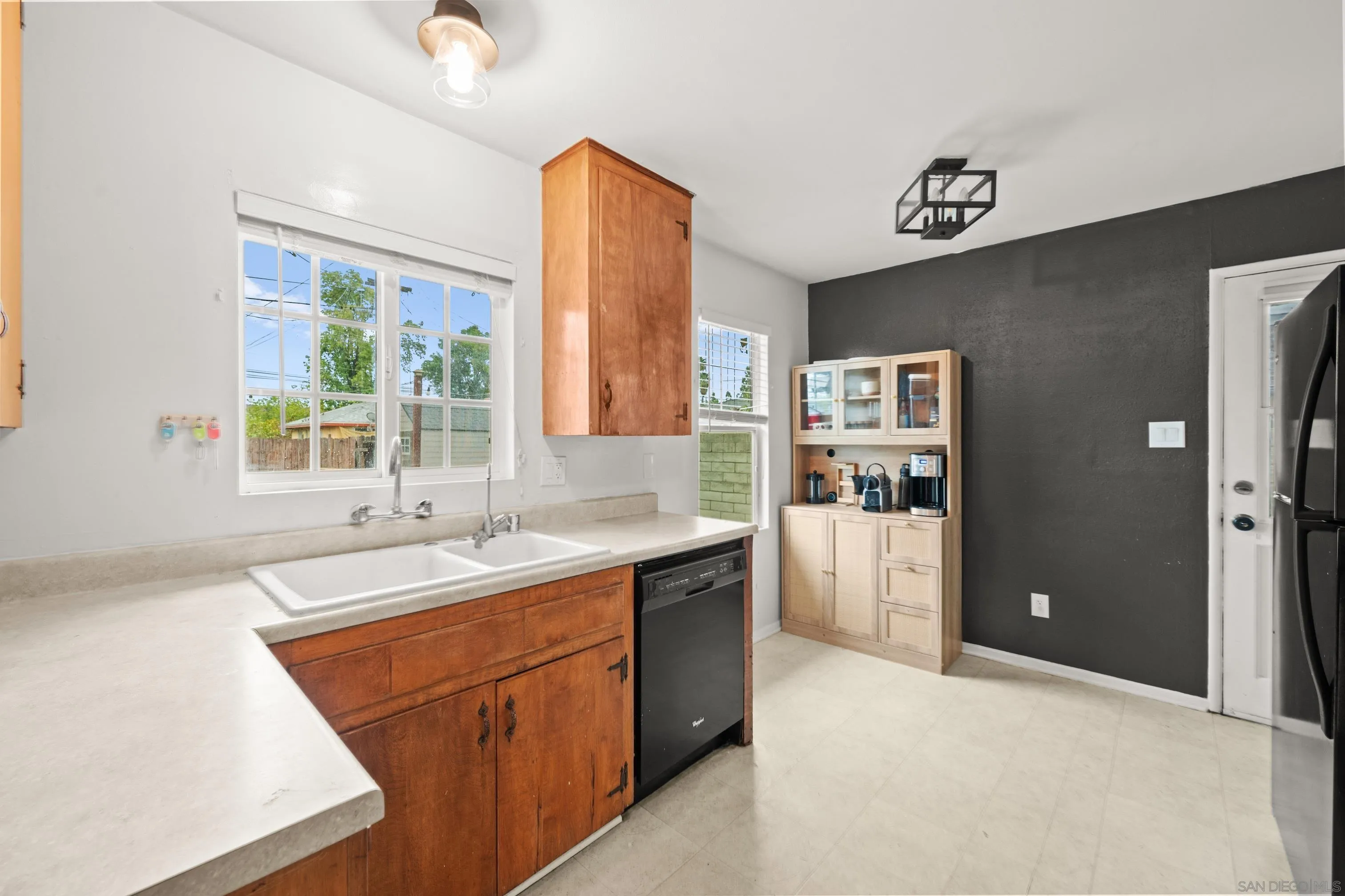6656 Cathy Place Riverside, CA 92504 - Photo 22 of 49 a kitchen with a sink cabinets and window