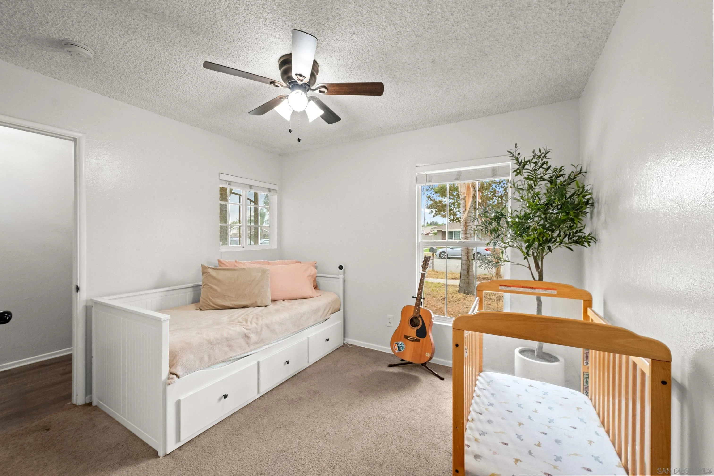 6656 Cathy Place Riverside, CA 92504 - Photo 26 of 49 a bedroom with a bed and a chandelier