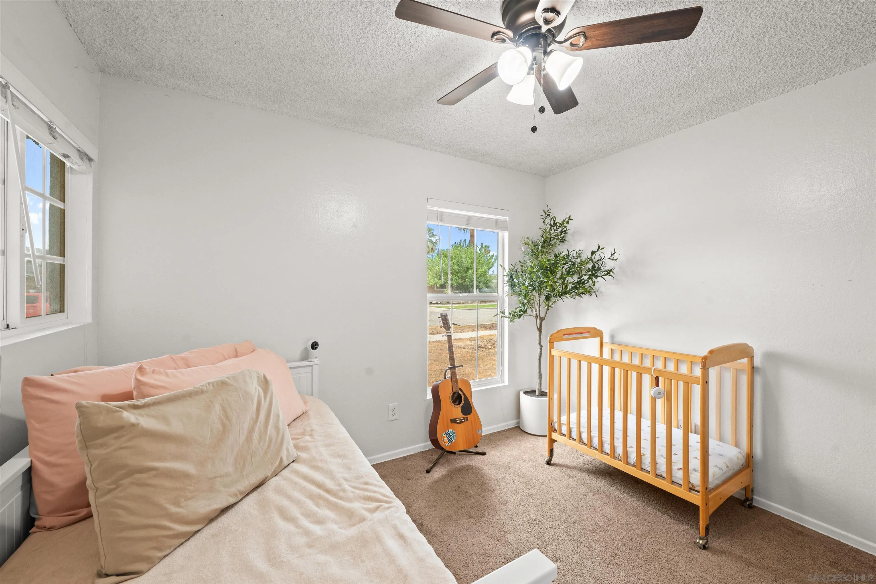 6656 Cathy Place Riverside, CA 92504 - Photo 27 of 49 a bedroom with furniture and a window