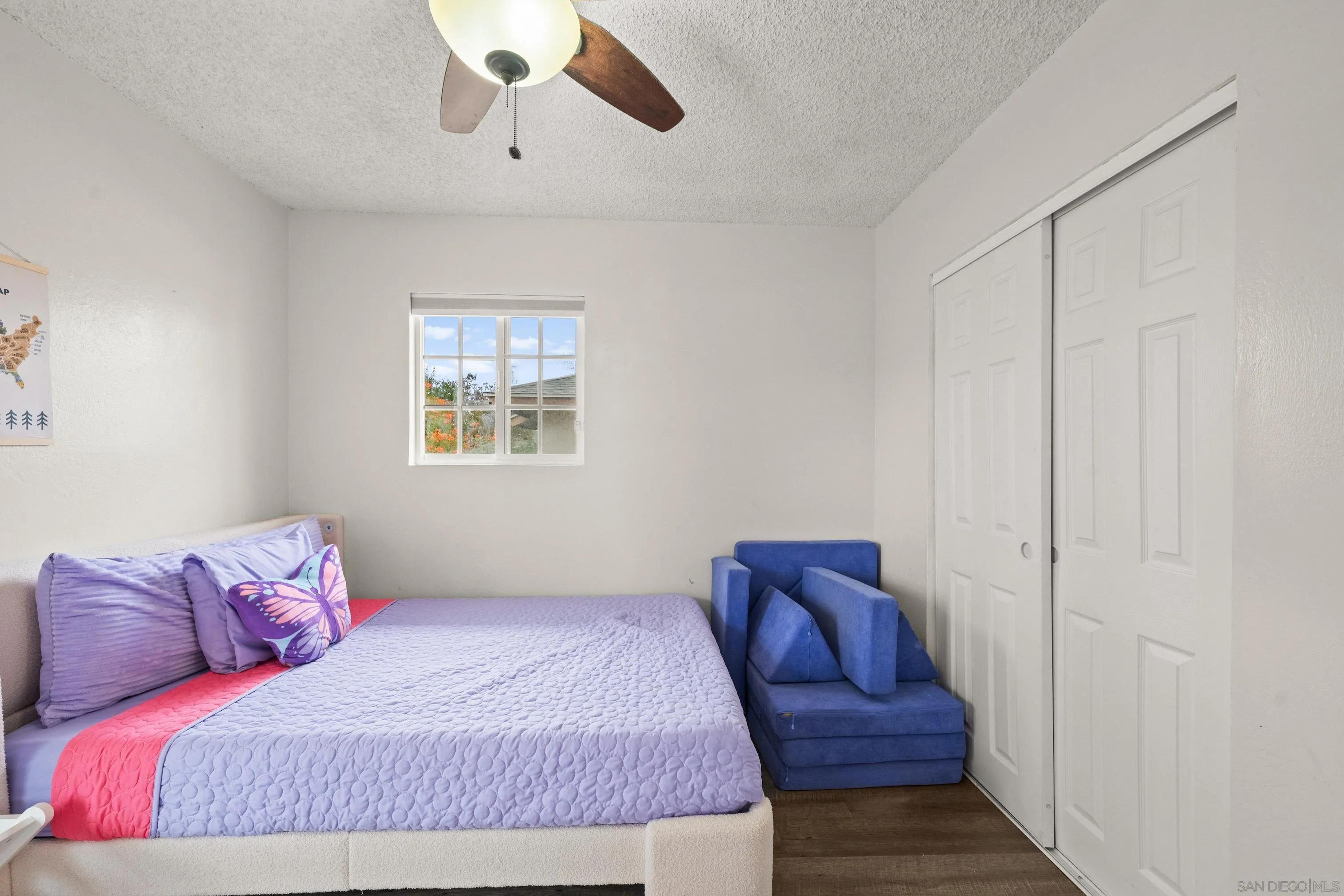 6656 Cathy Place Riverside, CA 92504 - Photo 29 of 49 a bedroom with a bed and window
