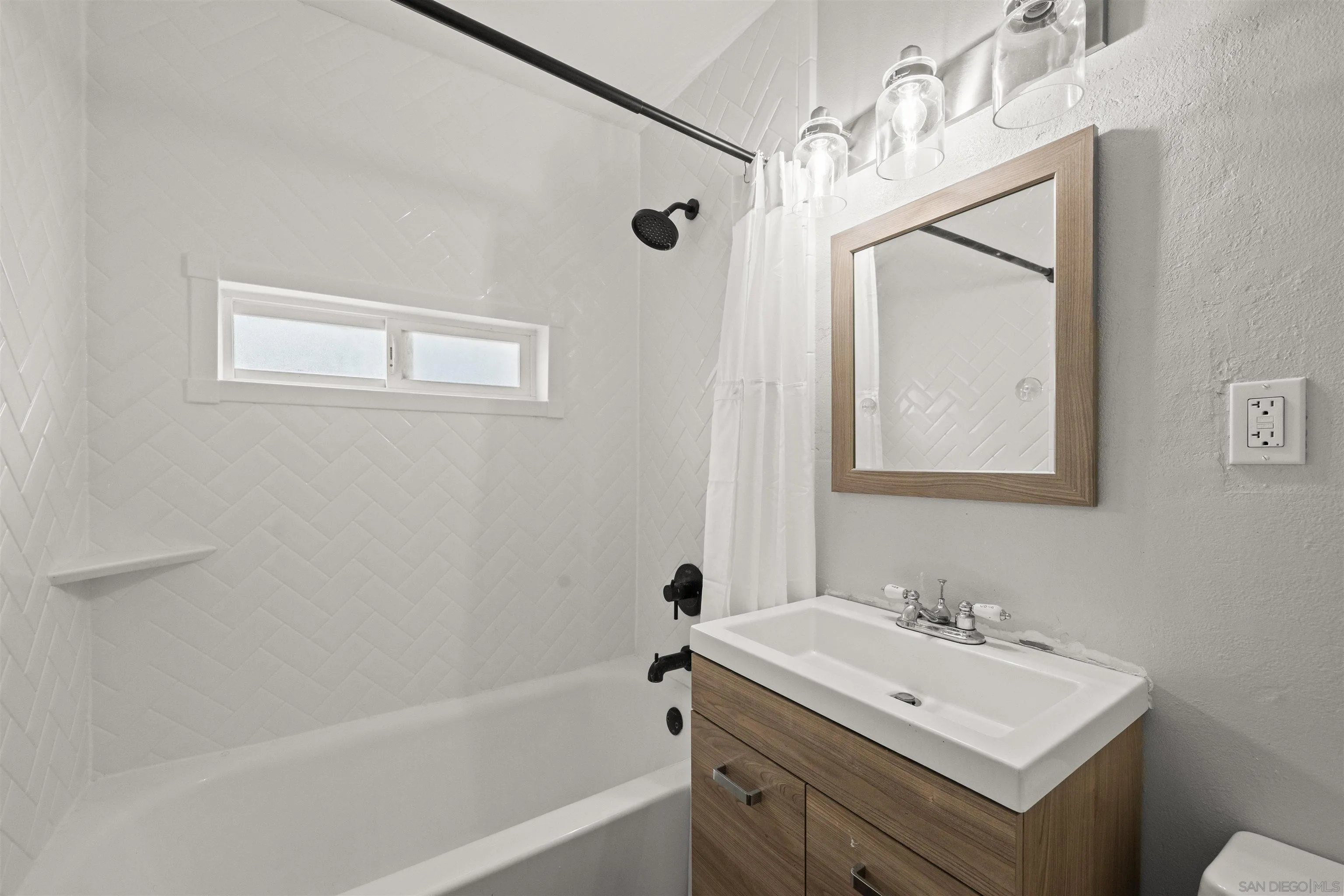 6656 Cathy Place Riverside, CA 92504 - Photo 33 of 49 a bathroom with a sink toilet and shower