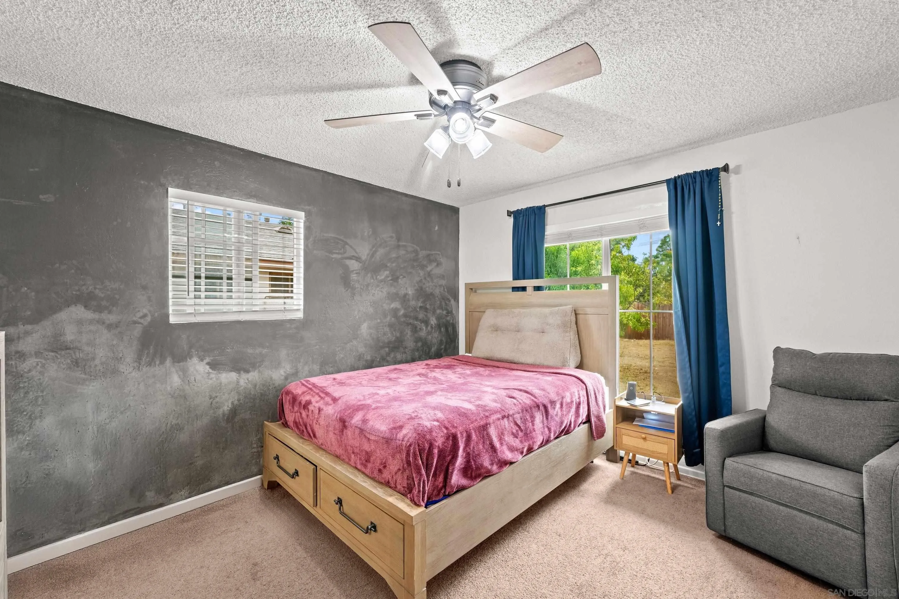 6656 Cathy Place Riverside, CA 92504 - Photo 36 of 49 a bedroom with a bed and ceiling fan