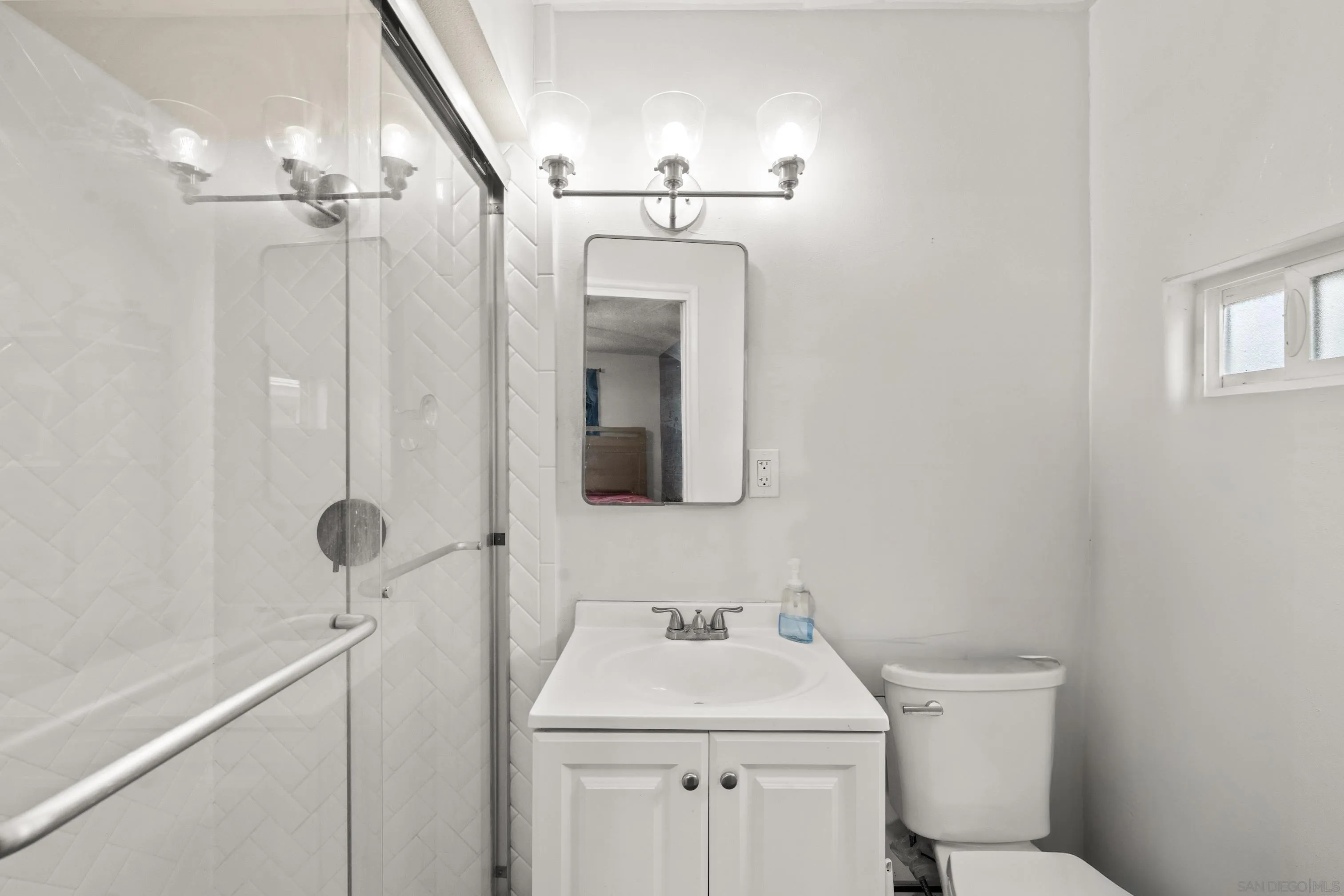 6656 Cathy Place Riverside, CA 92504 - Photo 38 of 49 a bathroom with a sink a toilet and shower