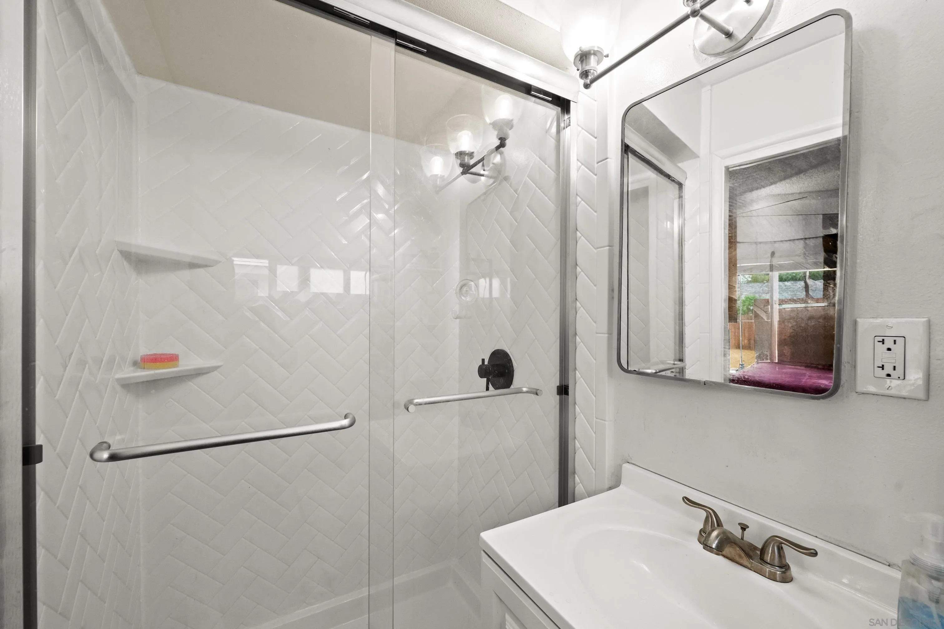 6656 Cathy Place Riverside, CA 92504 - Photo 39 of 49 a bathroom with a shower and a sink