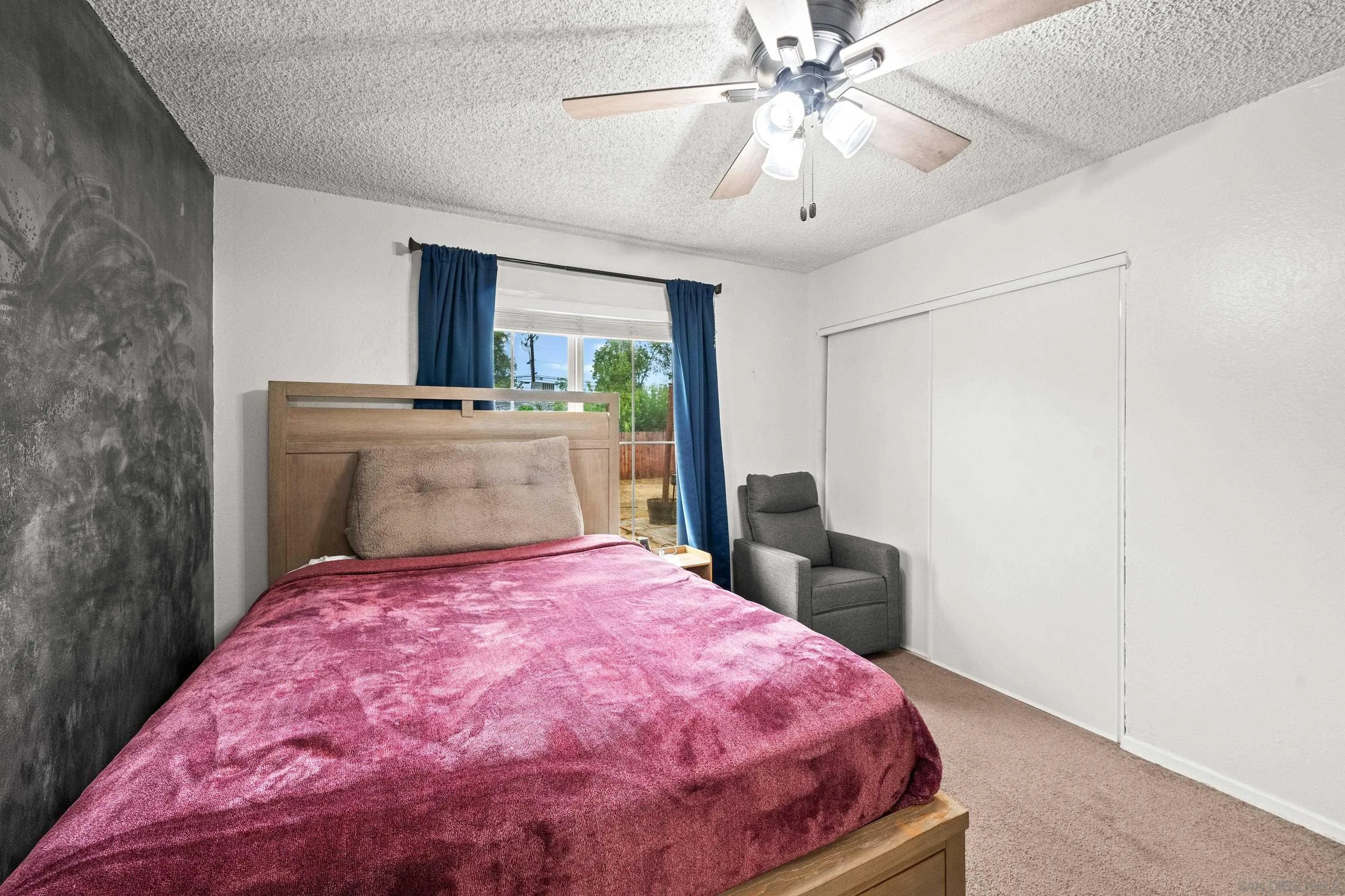 6656 Cathy Place Riverside, CA 92504 - Photo 40 of 49 a bedroom with a bed and a chandelier