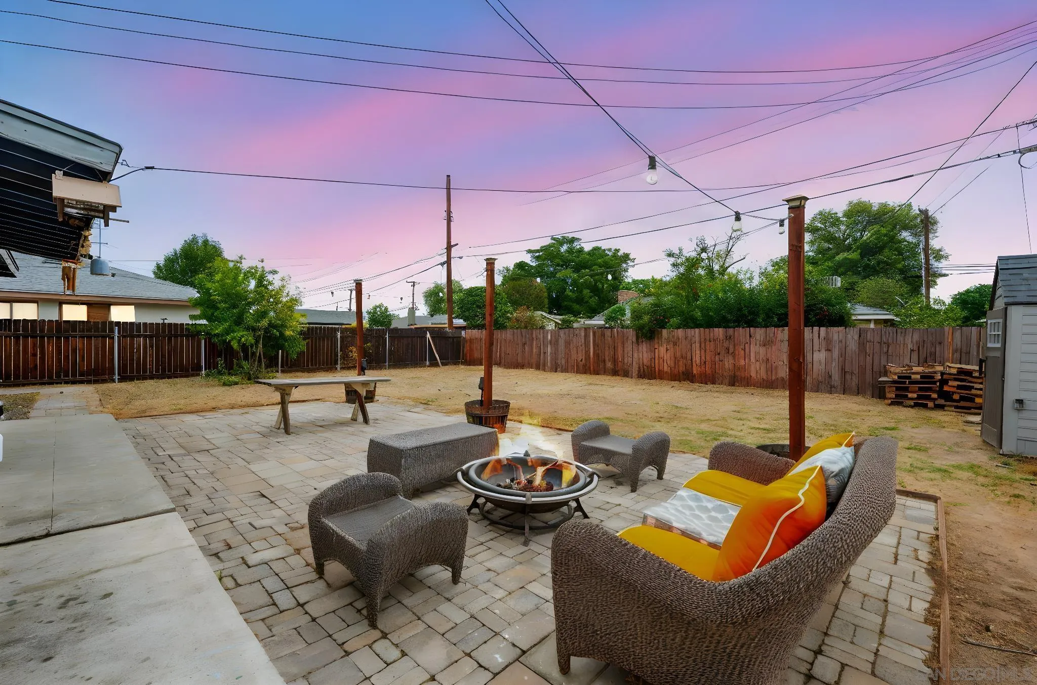 6656 Cathy Place Riverside, CA 92504 - Photo 4 of 49 a view of a patio with couches table and chairs with wooden fence