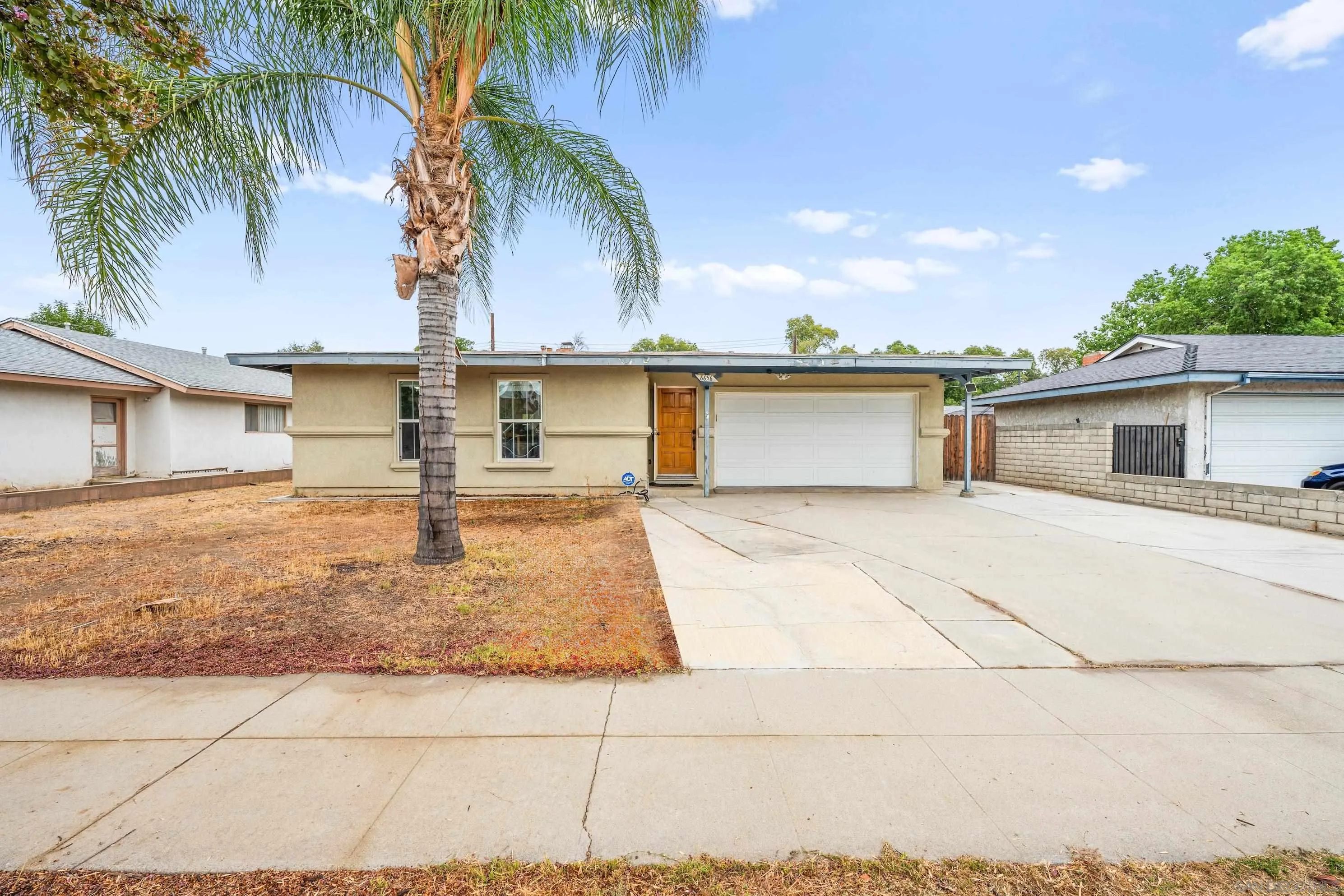 6656 Cathy Place Riverside, CA 92504 - Photo 8 of 49 a front view of a house with a garden
