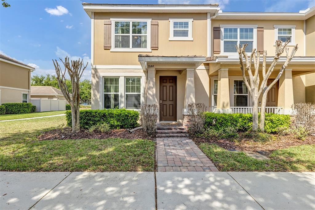7644 Ripplepointe Way Windermere, FL 34786 - Photo 1 of 52 front view of a house with a yard