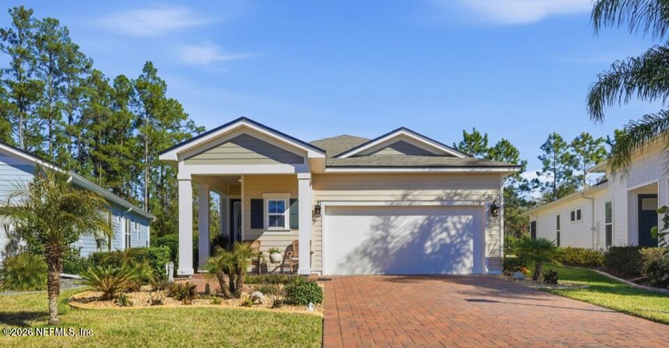 979 Rustic Ml Drive St. Augustine, FL 32092 - Photo 1 of 46 a front view of a house with garden