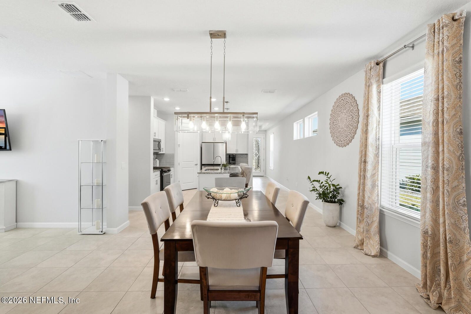 979 Rustic Ml Drive St. Augustine, FL 32092 - Photo 11 of 46 a view of a dining room with furniture window and wooden floor