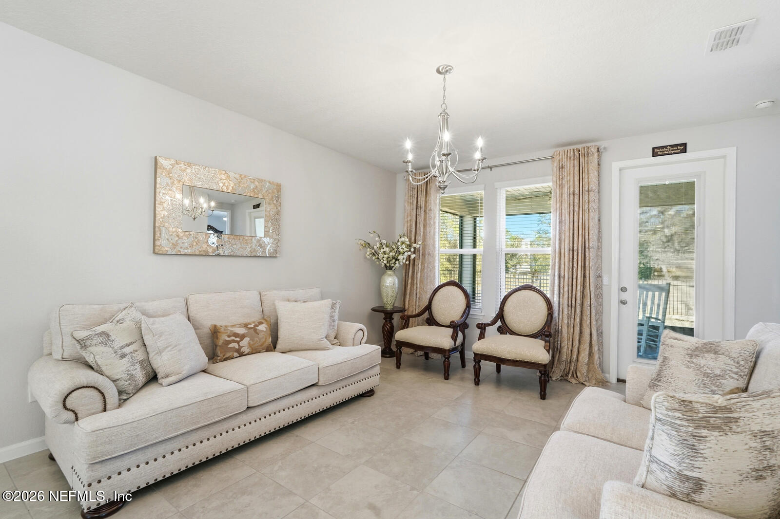 979 Rustic Ml Drive St. Augustine, FL 32092 - Photo 12 of 46 a living room with furniture and a chandelier