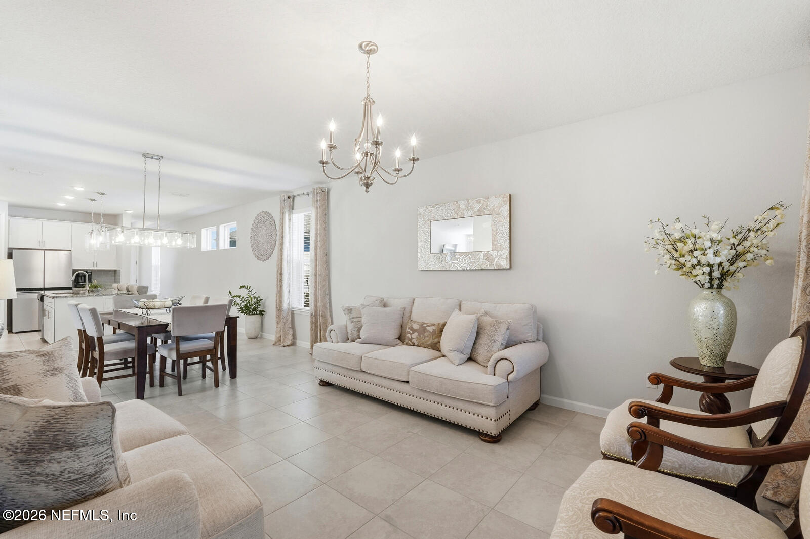 979 Rustic Ml Drive St. Augustine, FL 32092 - Photo 14 of 46 a living room with furniture and a chandelier