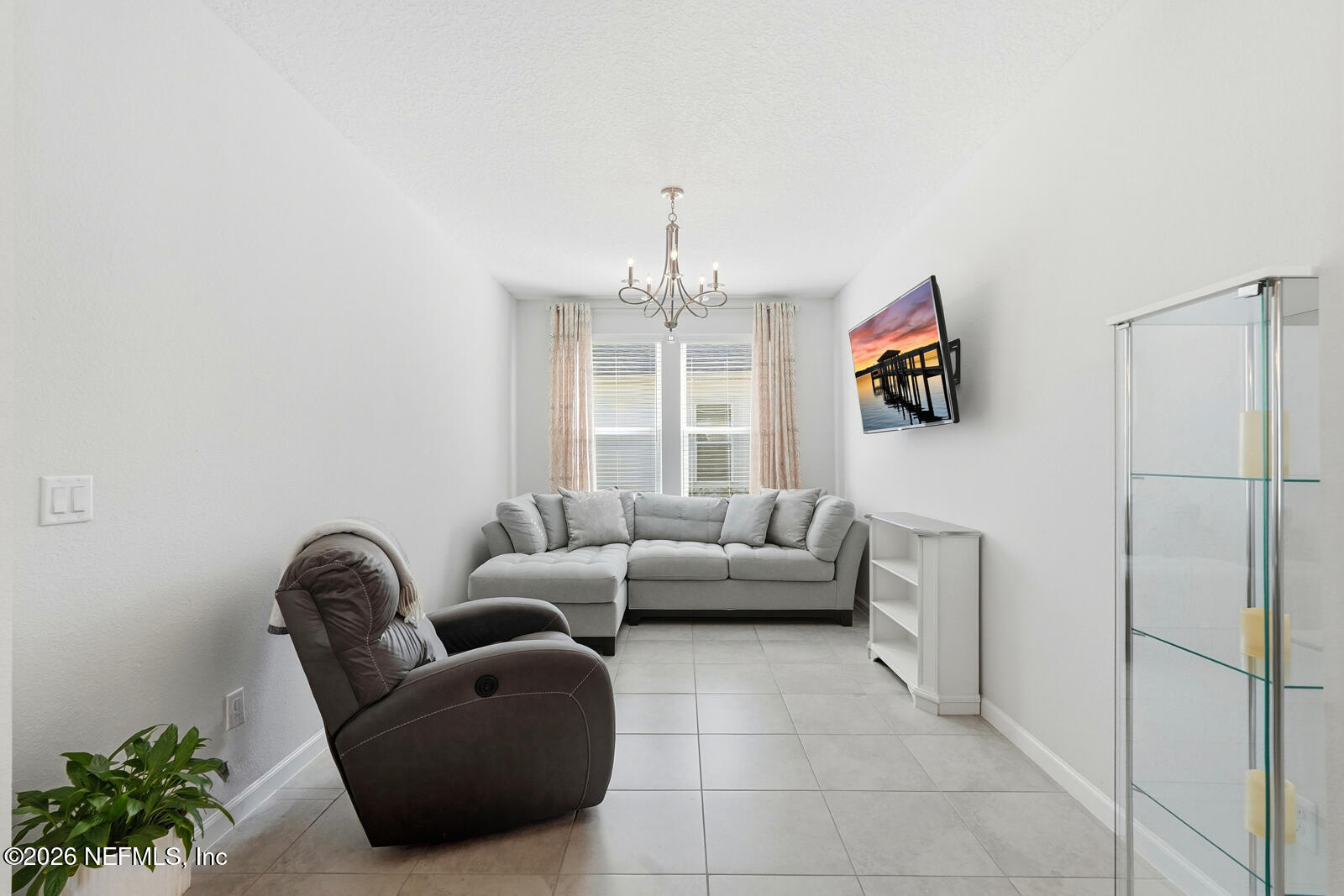 979 Rustic Ml Drive St. Augustine, FL 32092 - Photo 15 of 46 a living room with furniture and a chandelier