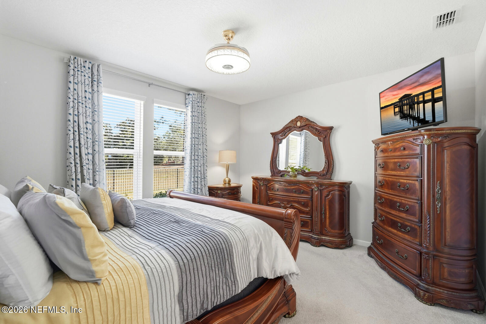 979 Rustic Ml Drive St. Augustine, FL 32092 - Photo 17 of 46 a bedroom with a bed and dresser