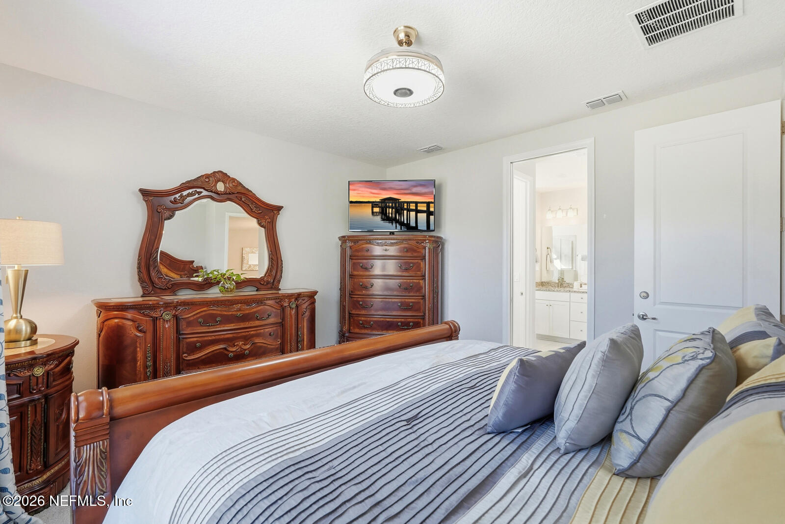 979 Rustic Ml Drive St. Augustine, FL 32092 - Photo 18 of 46 a bedroom with a bed and a dresser