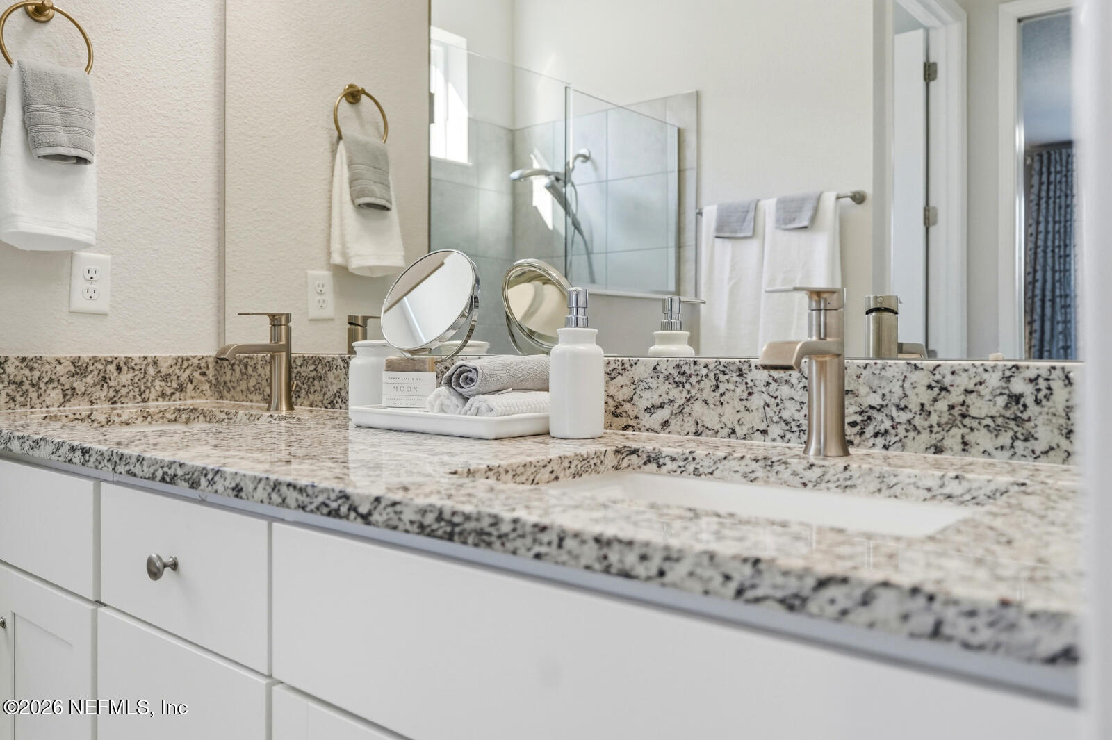 979 Rustic Ml Drive St. Augustine, FL 32092 - Photo 20 of 46 a bathroom with a granite countertop sink and a mirror