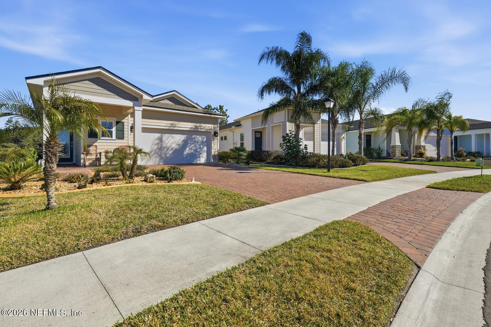 979 Rustic Ml Drive St. Augustine, FL 32092 - Photo 2 of 46 a front view of a house with a yard