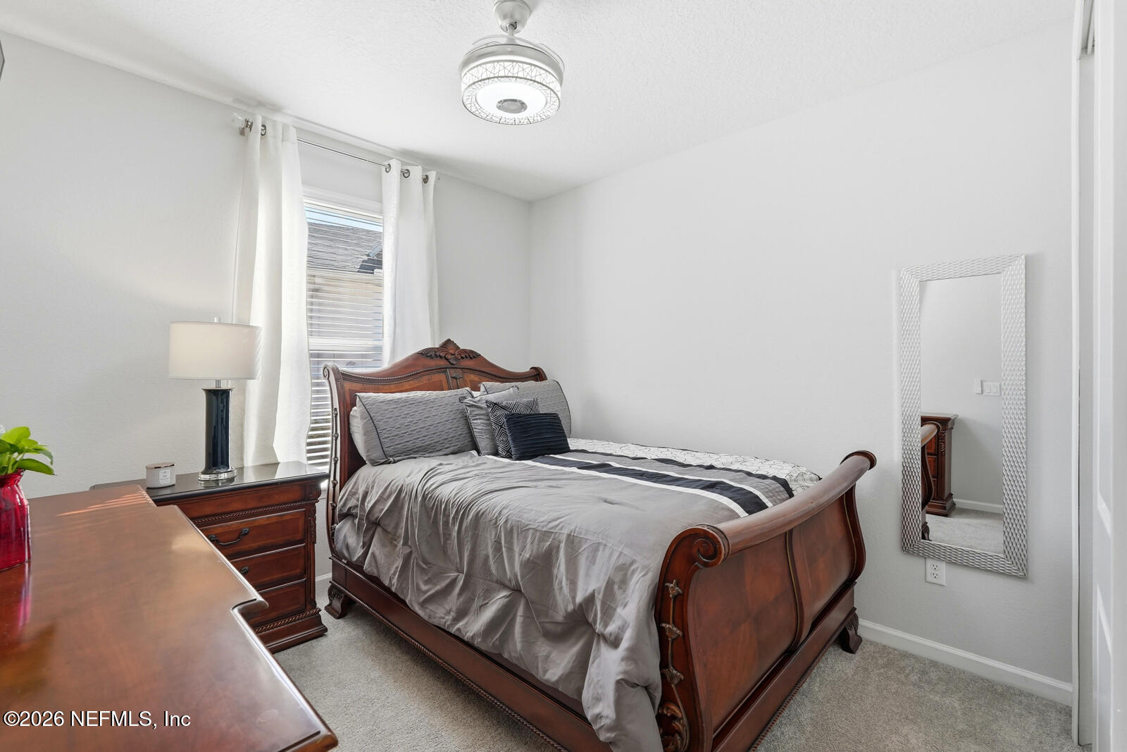 979 Rustic Ml Drive St. Augustine, FL 32092 - Photo 22 of 46 a bedroom with a bed and a window