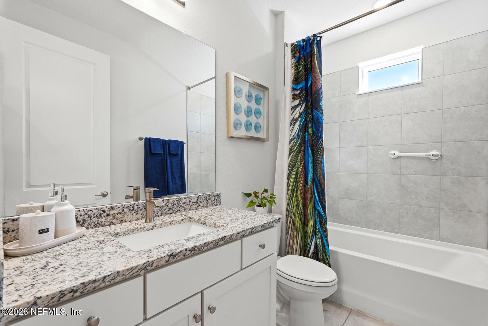 979 Rustic Ml Drive St. Augustine, FL 32092 - Photo 23 of 46 a bathroom with a granite countertop sink toilet and a bathtub