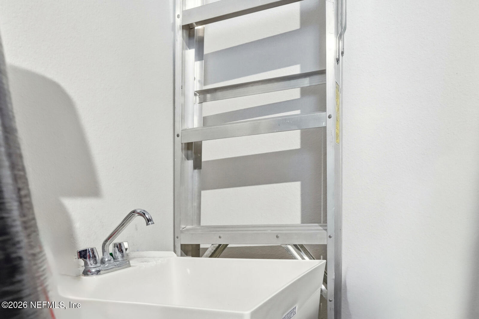 979 Rustic Ml Drive St. Augustine, FL 32092 - Photo 25 of 46 a bathroom with a sink and a mirror
