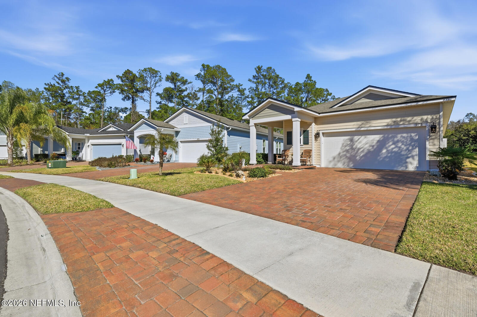 979 Rustic Ml Drive St. Augustine, FL 32092 - Photo 3 of 46 a front view of a house with a yard and garage