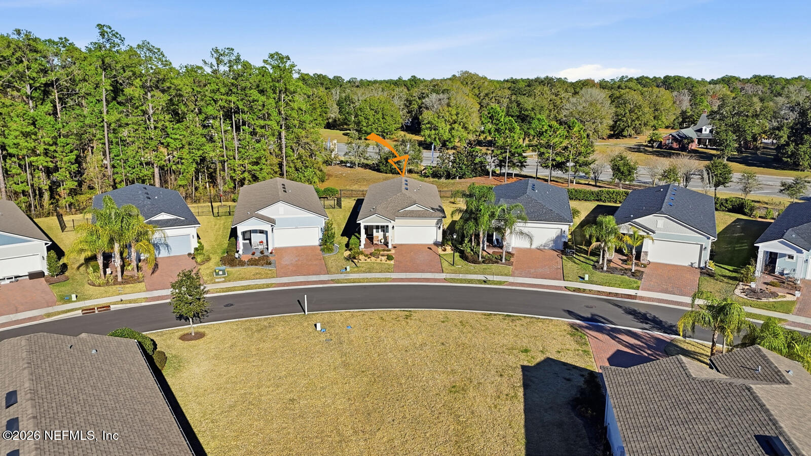979 Rustic Ml Drive St. Augustine, FL 32092 - Photo 33 of 46 an aerial view of a house with swimming pool and lake view