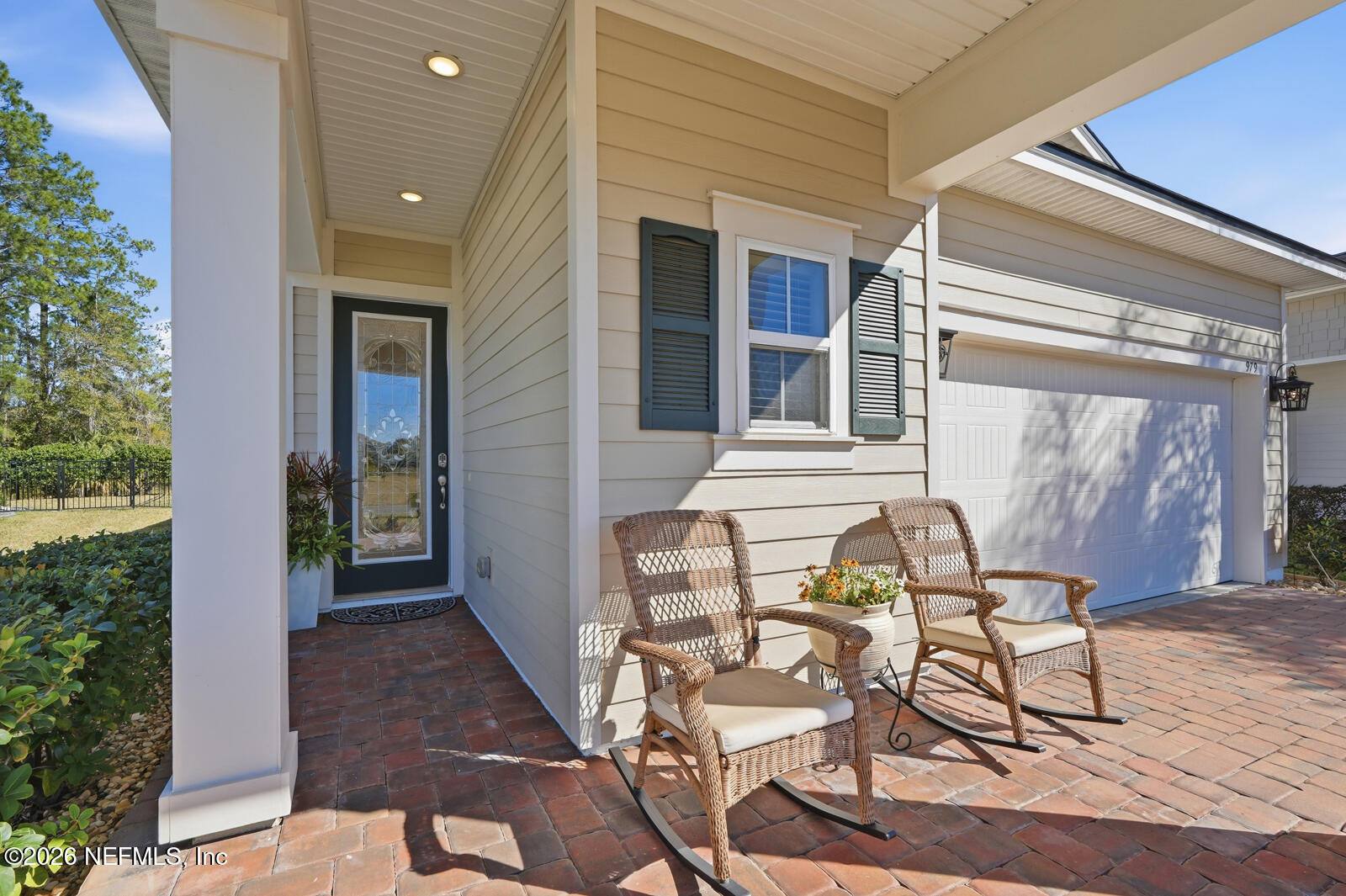 979 Rustic Ml Drive St. Augustine, FL 32092 - Photo 4 of 46 a view of a patio with table and chairs and potted plants