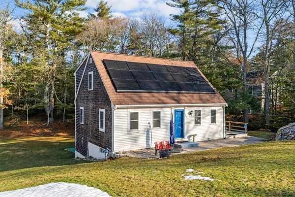 a view of house with backyard outdoor seating and swimming pool