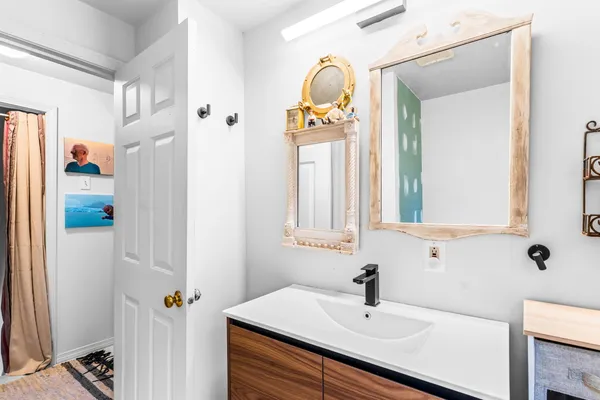 a bedroom with double bed and a window